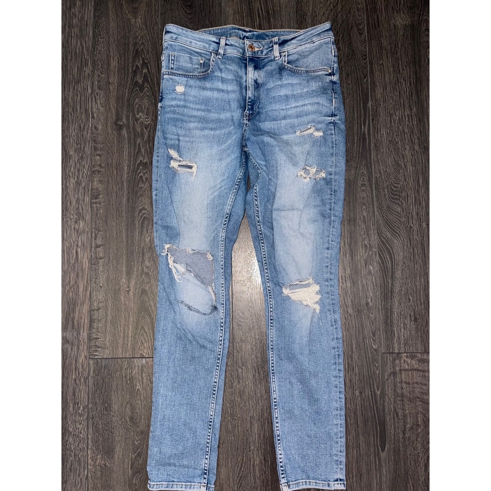 Distressed light blue straight leg jeans